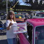 Welcome to the St.Veronica's 2008 car show. Kathy shows off the last remaining origial MPM window flag.