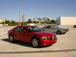 Hemi Gil's 66 426 hemi Charger shares this photo with a new hemi Charger.