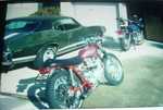 My first real car a 1969 GTO next to my first real motorcycle a 1968 Triumph 500 that i modified just a bit!