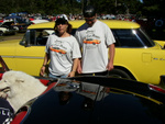 Joann and Kevin showing off her car that was picked to be on the shirt