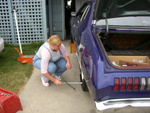 Changing the tire.